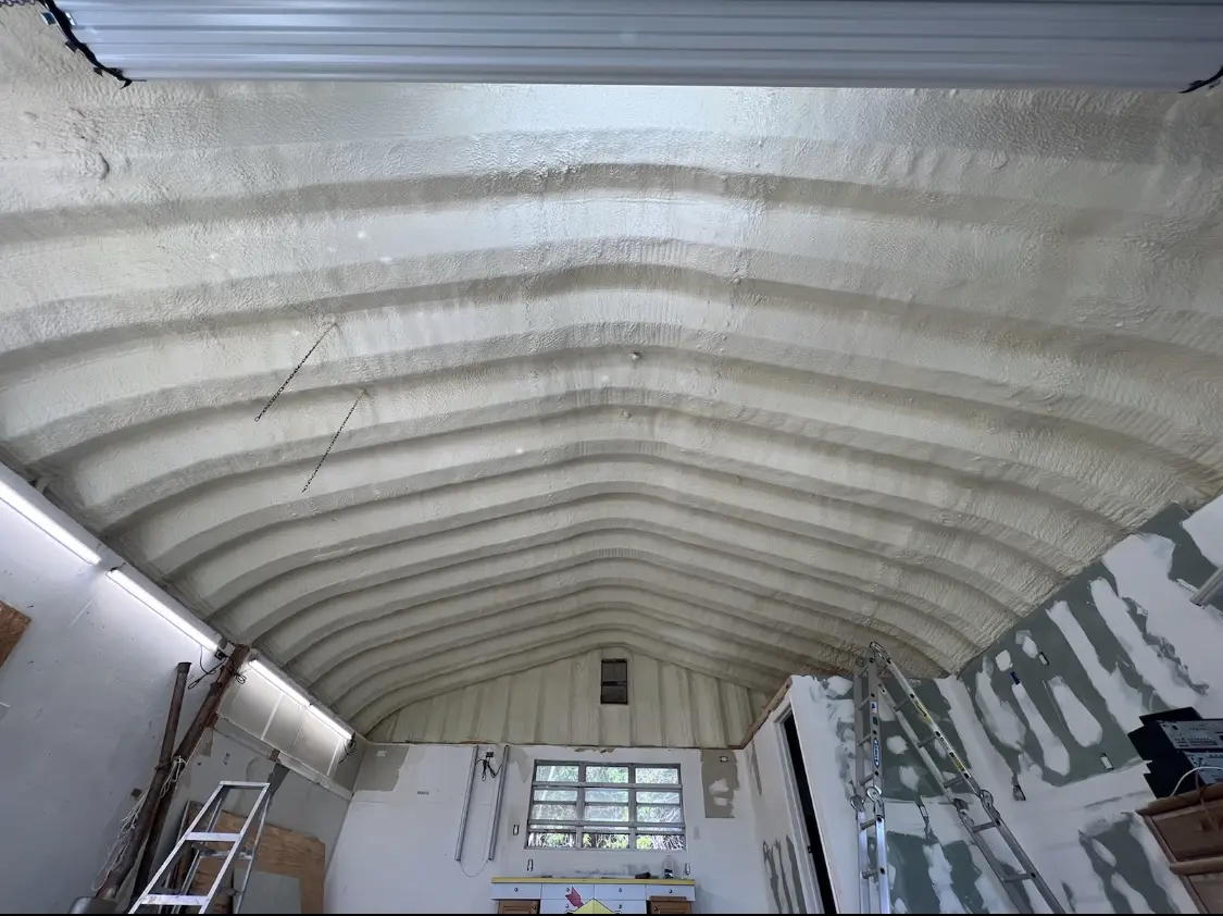 Spray polyurethane foam applied to the underside of a metal roof deck in Decatur